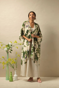 A lightweight three quarter length kimono in a green acer leaf on a rich ivory background