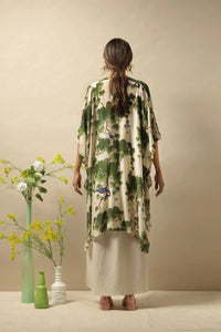 A lightweight three quarter length kimono in a green acer leaf on a rich ivory background