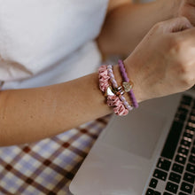 Load image into Gallery viewer, Wear your dusty pink silk hair scrunch with a gold heart charm as a bracelet too!