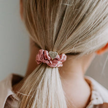 Load image into Gallery viewer, A dusty pink silk hair scrunch with a gold heart charm