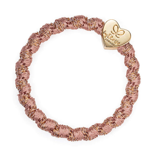 Luxurious hair band in twisted rose coloured silk with a gold heart charm