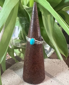 Delicate sterling silver ring, fully adjustable with an oval turquoise stone