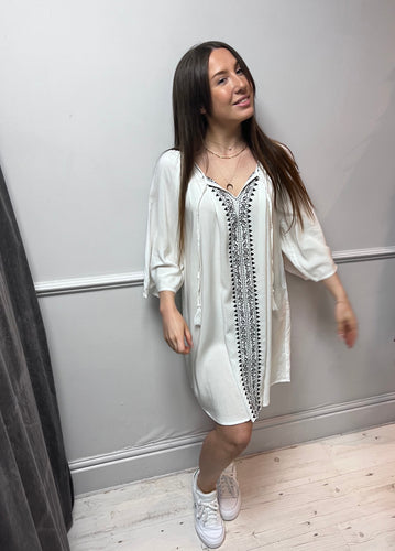 White kaftan dress with black embroidery down the front