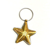 Load image into Gallery viewer, Small brass star on a keyring hoop. Handmade in Marrakech.