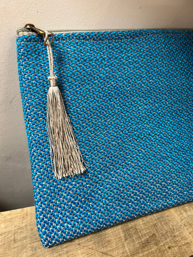 Bright turquoise generous sized clutch purse with a cactus silk grey tassel