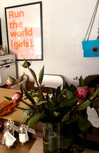 Load image into Gallery viewer, Framed &quot;Run the world (girls)&quot; print in neon orange on pastel pink