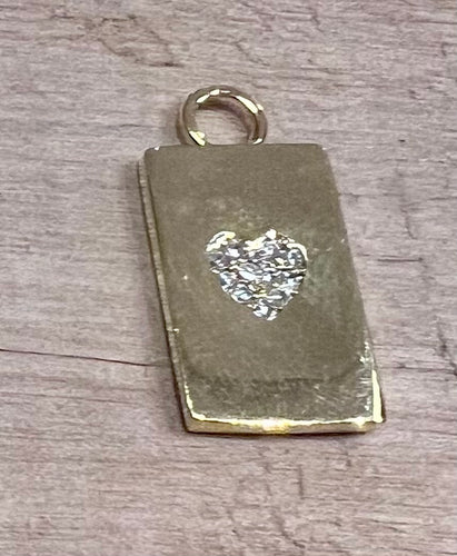 rectangular charm with a crystal heart in the centre 2 X 1 cm