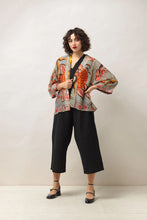 Load image into Gallery viewer, A short kimono of earthy tones contrasted against joyful burnt orange-coloured blooms all on a soft grey background