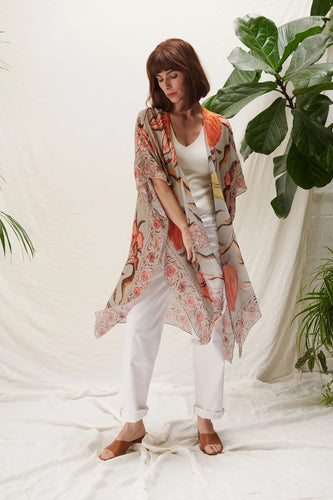 A lightweight kimono in grey with bold florals in rich orange, yellow and brown