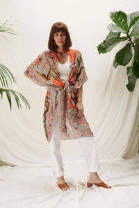 A lightweight kimono in grey with bold florals in rich orange, yellow and brown