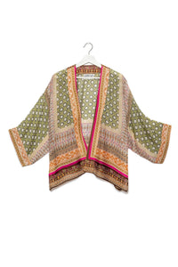 Moroccan design short kimono in green, orange, pink and rust.