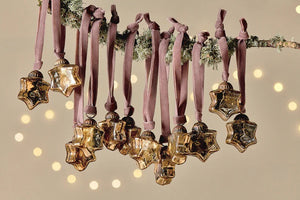 Small gold recycled glass star baubles on velvet ties