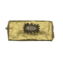 Load image into Gallery viewer, Luxury gold makeup bag with a bold sunshine eye motif 