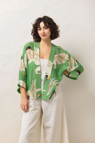 Pea green kimono with beautiful images of storks in a variety of cream colours