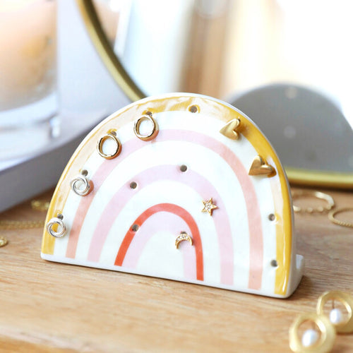 Rainbow shaped ceramic earring holder with 14 holes and red, pink and yellow rainbow colours