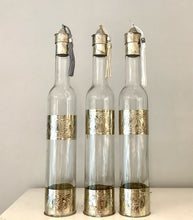 Load image into Gallery viewer, Hand decorated oil bottles with engraved metal made in Marrakech.