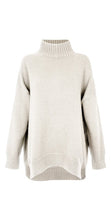 Load image into Gallery viewer, A luxurious 50% merino wool jumper with a funnel neck, loose fit and stunning side slits in a soft light oatmeal. 