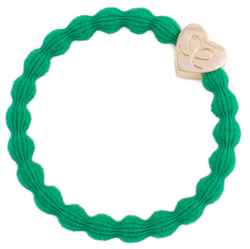 Emerald green hair band with a gold heart charm on it