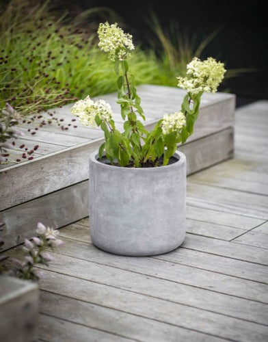A weatherproof and frostproof fibre clay planter. Minimalist in style with simple straight block shape. 27cm diameter. 