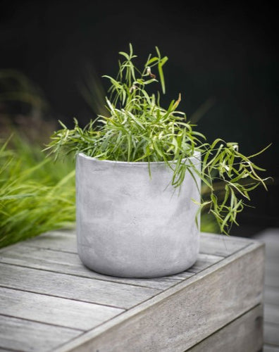 A weatherproof and frost proof planter in grey. A minimalist block design. 