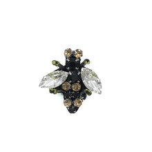 Load image into Gallery viewer, A bee pin with clear jewel wings and a body of black and gold beads