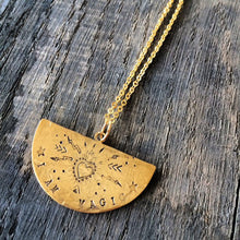 Load image into Gallery viewer, A semi circle brass pendant hand stamped with a heart and various symbols with the words I AM MAGIC on a gold plated chain