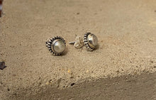 Load image into Gallery viewer, The pearl is encased in sterling silver, with a delicate design around the edge. These ladies earrings have a butterfly fastening to the back. 