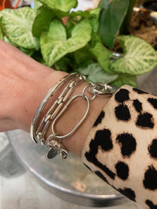 A sterling silver 925 simple cuff bracelet, the design is a classic sqaure shape to the bangle, with an open end so it can be slipped on over your wrist.
