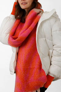 Match these neon orange fingerless gloves with this orange and fuchsia scarf