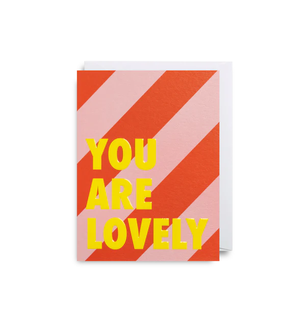 You are lovely in bright yellow on a pink and red striped background