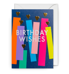 A birthday card with lots of candles on it in lots of bright colours.