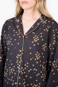 Dark grey pyjama top with gold stars and gold piping