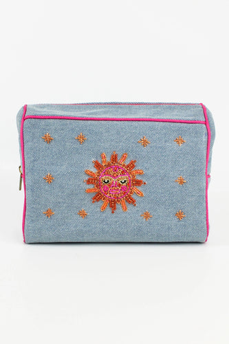 Wash bag in washed denim with a bright sparkly sun face on the front with a scattering of sparkles