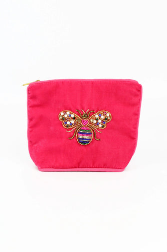 A Vibrant pink zip up purse perfect for keeping little bits in. Hand embroidered with a colourful bee in pearls and crystals