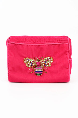 Vibrant pink velvet finish makeup bag with a brightly coloured bee hand stitched in beads and pearls