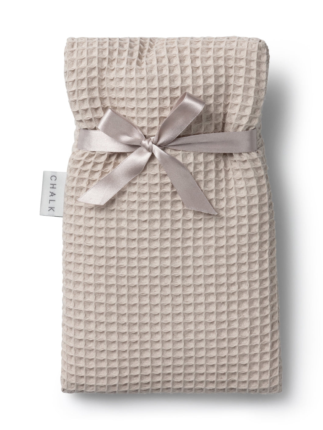 small hot water bottle in stone with a waffle finish