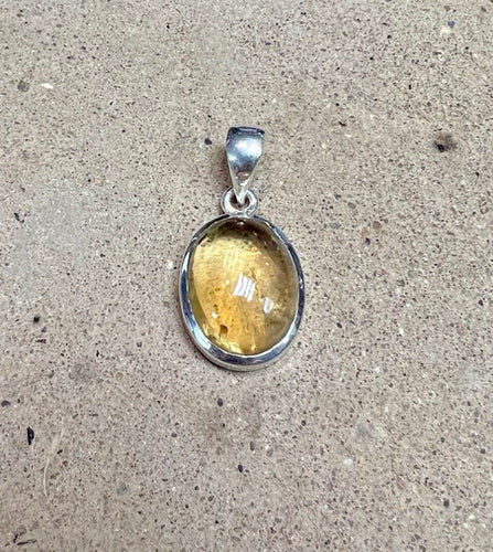 A Citrine Oval Pendant on a Sterling Silver backing 