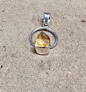 Citrine Stone In a Sterling Silver Setting On a Circular Pendant