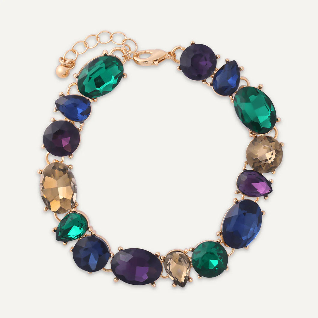 Bracelet with differently cut crystals in navy , green, purple and gold