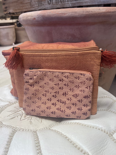 Small cotton zip up purse with a pattern in terracotta