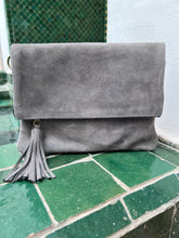 Load image into Gallery viewer, Grey suede classic fold over handbag with tassel - comes with a long  adjustable strap and a wrist strap - BE Lifestyle Boutique