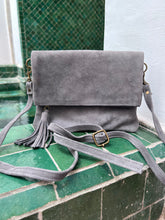 Load image into Gallery viewer, Grey suede classic fold over handbag with tassel - comes with a long  adjustable strap and a wrist strap - BE Lifestyle Boutique