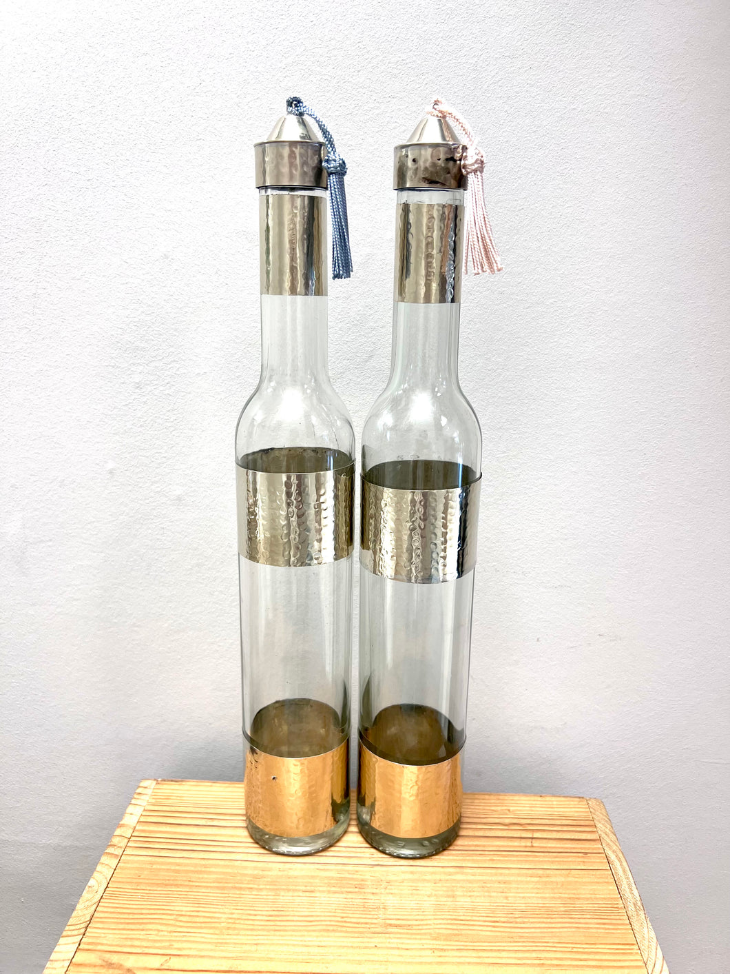 Moroccan oil and vinegar bottles with hammered metal detail  - add your own tassel by following the link