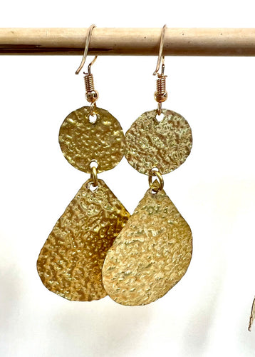 Long statement earrings with a circle and teardrop all in textured brass