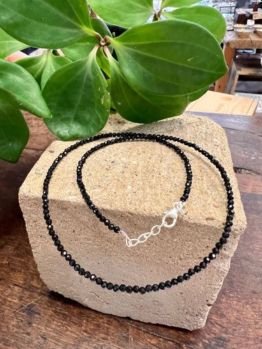 Fine black crystal short necklace on a sterling silver wire and sterling silver extender chain and crab closure
