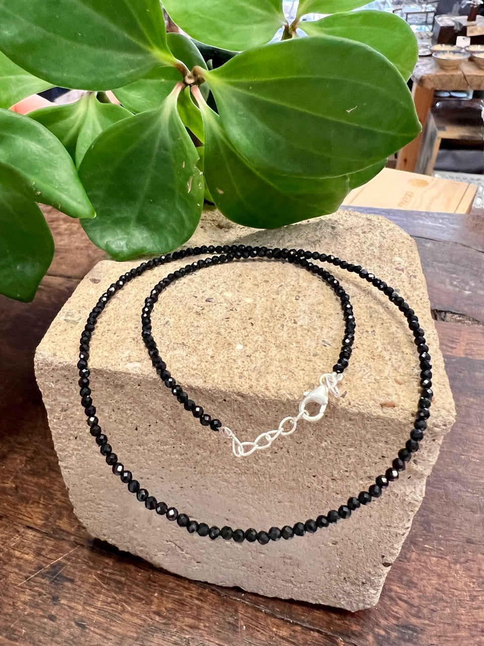 Fine black crystal short necklace on a sterling silver wire and sterling silver extender chain and crab closure