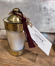 Load image into Gallery viewer, Amber candle in a beaten Moroccan pot and with a purple tassel