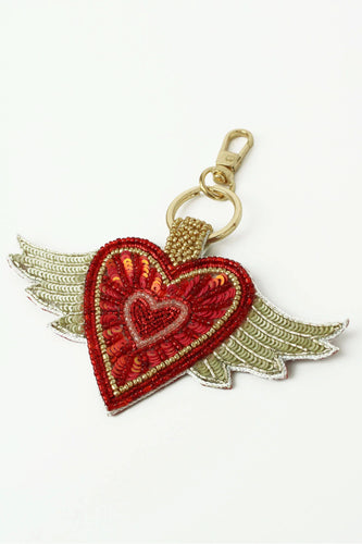 Embroidered sequin heart keyring with wings in gold.