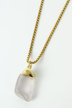 Load image into Gallery viewer, Rose quartz gem encased in gold with a gold chain necklace