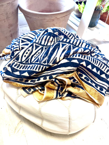 Navy block printed fish design scarf with a woven gold edge. 100% cotton